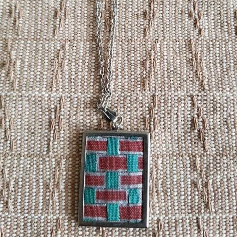 Repurposed Book Cover Necklace, red and turquoise weave pattern