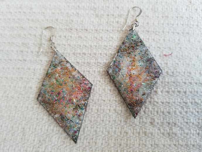 handmade diamond shape dangle earrings by Eugenia Ortiz