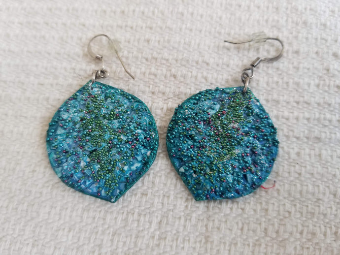 Textured teal blue dangle earrings by Eugenia Ortiz