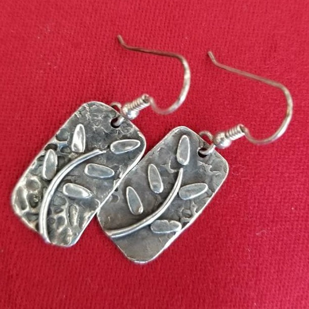 Sterling silver dangle earrings with leaf pattern, made by Gale Schlagel of Kansas City